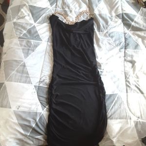 Black bodycon scoop neck gold chain back dress